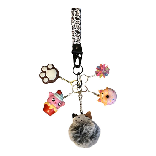 Cat fidgets with key strap